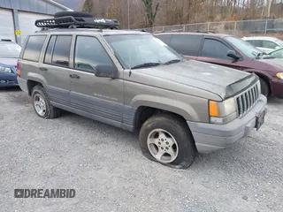 1996 Jeep Grand Cherokee with VIN 1J4EZ58S1TC112995, listed as a IAAI auction lot 41706966 with 356,727 mi miles and . Bid and sale history available at DreamBid. Image 1.
