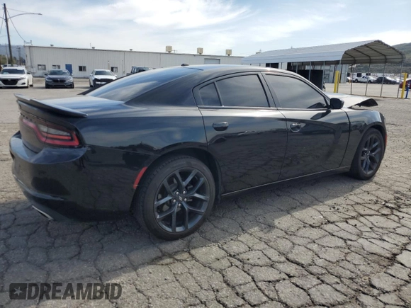 2021 Dodge Charger SXT with VIN 2C3CDXBG9MH682354, listed as a Copart auction lot 48586415 with 112,449 mi miles and Salvage Title. Bid and sale history available at carsss.com. Image 3.