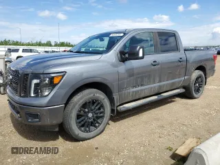 2018 Nissan Titan Pro-4X z VIN 1N6AA1E55JN520658, wystawiony jako Copart lot #58368245 z przebiegiem 129 088 mil mil oraz Czysty tytuł • Clean title. Historia ofert i sprzedaży dostępna na DreamBid. Obrazek 1.