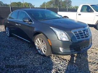 2013 Cadillac XTS Luxury with VIN 2G61P5S3XD9141306, listed as a IAAI auction lot 42034077 with 120,294 mi miles. Bid and sale history available at carsss.com. Image 1.