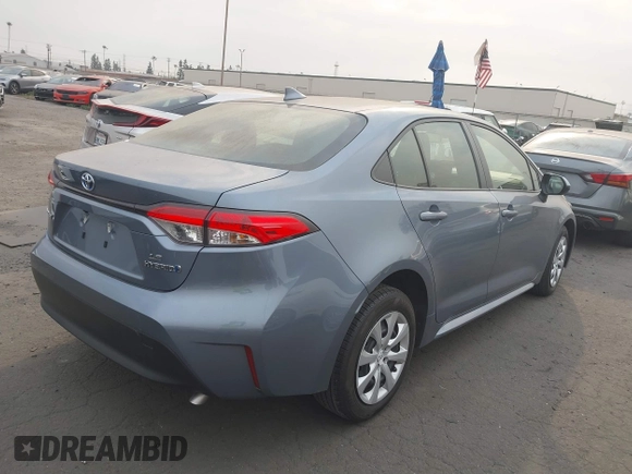 2023 Toyota Corolla Hybrid LE with VIN JTDBCMFE0P3023071, listed as a IAAI auction lot 41273943 with 26,250 mi miles. Bid and sale history available at carsss.com. Image 4.