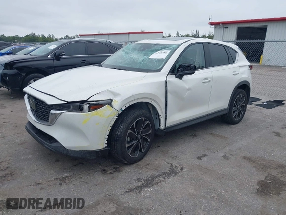 2023 Mazda CX-5 2.5 S Premium Package with VIN JM3KFBDM1P0126787, listed as a IAAI auction lot 41164586 with 12,076 mi miles. Bid and sale history available at carsss.com. Image 17.