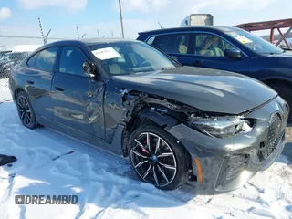2023 BMW i4 M50 with VIN WBY33AW03PFN81310, listed as a IAAI auction lot 41387873 with 21,586 mi miles. Bid and sale history available at carsss.com. Image 1.