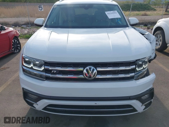 2018 Volkswagen Atlas SE z VIN 1V2FR2CA2JC540657, wystawiony jako IAAI lot #42115554 z przebiegiem 107 309 mil mil oraz . Historia ofert i sprzedaży dostępna na DreamBid. Obrazek 12.