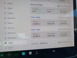 2019 Tesla Model 3 Mid Range with VIN 5YJ3E1EA2KF305834, listed as a IAAI auction lot 41719610 with 126,333 mi miles and . Bid and sale history available at DreamBid. Image 7.