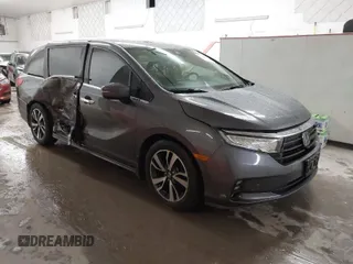 2021 Honda Odyssey Touring with VIN 5FNRL6H86MB026038, listed as a IAAI auction lot 41735249 with 68,480 mi miles. Bid and sale history available at carsss.com. Image 1.