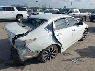 2014 Nissan Altima SV with VIN 1N4AL3AP0EC278546, listed as a IAAI auction lot 41762901 with 121,756 mi miles and . Bid and sale history available at DreamBid. Image 4.