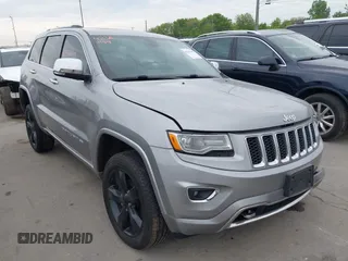 2015 Jeep Grand Cherokee Overland z VIN 1C4RJFCG9FC116224, wystawiony jako IAAI lot #42361149 z przebiegiem 279 999 mil mil oraz . Historia ofert i sprzedaży dostępna na DreamBid. Obrazek 1.