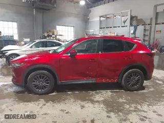 2021 Mazda CX-5 Touring with VIN JM3KFACM3M0331597, listed as a IAAI auction lot 41687333 with 68,562 mi miles. Bid and sale history available at carsss.com. Image 14.