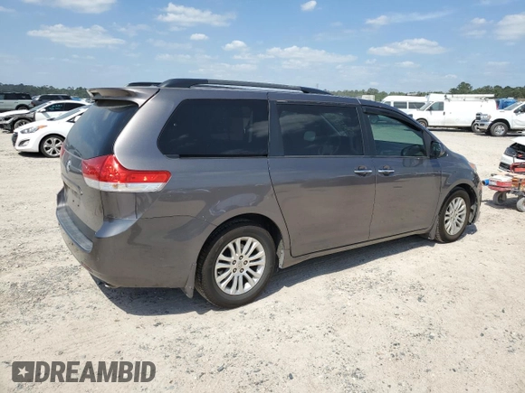 2012 Toyota Sienna XLE AAS with VIN 5TDYK3DCXCS199580, listed as a Copart auction lot 52455405 with 113,259 mi miles and Salvage Title. Bid and sale history available at DreamBid. Image 3.