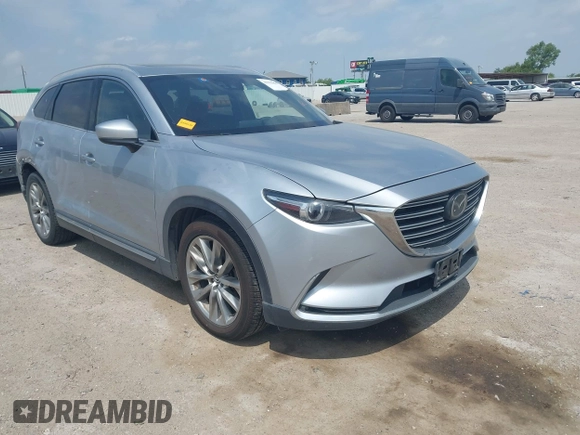 2016 Mazda CX-9 Signature with VIN JM3TCBEY9G0117785, listed as a IAAI auction lot 42331883 with 115,096 mi miles and . Bid and sale history available at DreamBid. Image 1.