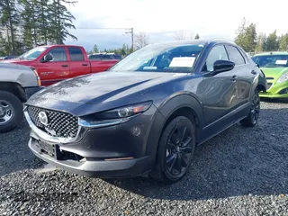 2021 Mazda CX-30 Premium with VIN 3MVDMBDY2MM239231, listed as a IAAI auction lot 41655159 with 22,679 mi miles and . Bid and sale history available at carsss.com. Image 18.