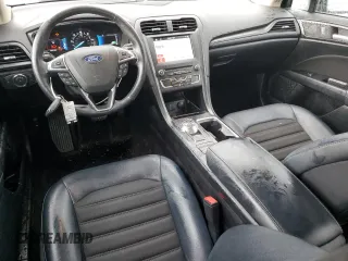 2018 Ford Fusion SE z VIN 3FA6P0LU9JR185726, wystawiony jako Copart lot #55471585 z przebiegiem 76 651 mil mil oraz Szkoda całkowita • Salvage title. Historia ofert i sprzedaży dostępna na DreamBid. Obrazek 8.