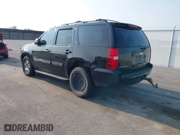 2014 Chevrolet Tahoe LT with VIN 1GNSCBE01ER235571, listed as a IAAI auction lot 42403118 with 238,069 mi miles and . Bid and sale history available at DreamBid. Image 3.