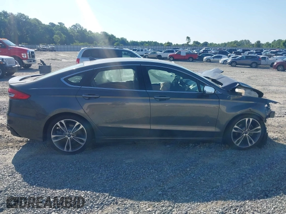 2020 Ford Fusion Titanium with VIN 3FA6P0K91LR175109, listed as a IAAI auction lot 42267532 with 75,000 mi miles and . Bid and sale history available at DreamBid. Image 13.