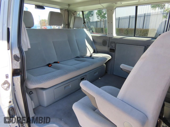 2003 Volkswagen EuroVan MV с VIN WV2NB47003H003033, выставлен на аукционе Copart как лот 47059195 с пробегом 164 173 миль миль и Чистый • Clean title. История ставок и продаж доступна на DreamBid. Изображение 6.