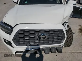 2023 Toyota Tacoma SR z VIN 3TMCZ5AN8PM589655, wystawiony jako Copart lot #56663615 z przebiegiem 43 327 mil mil oraz Szkoda całkowita • Salvage title. Historia ofert i sprzedaży dostępna na DreamBid. Obrazek 11.