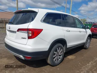 2021 Honda Pilot EX-L with VIN 5FNYF6H57MB054147, listed as a IAAI auction lot 42158910 with 37,811 mi miles and . Bid and sale history available at DreamBid. Image 4.
