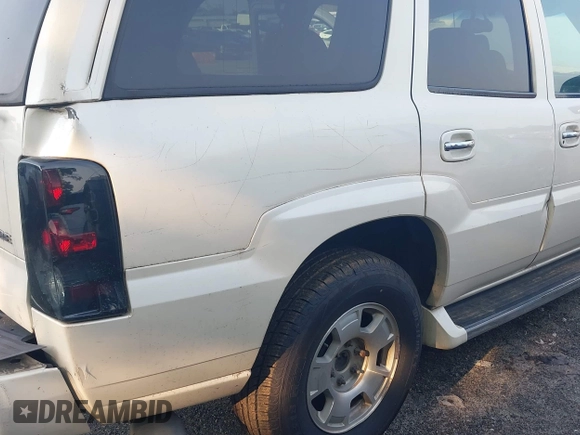 2002 Cadillac Escalade z VIN 1GYEK63N02R112364, wystawiony jako IAAI lot #42346753 z przebiegiem 216 891 mil mil oraz . Historia ofert i sprzedaży dostępna na DreamBid. Obrazek 12.