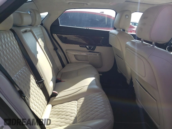 2017 Jaguar XJ with VIN SAJWJ2GD4H8W12163, listed as a Copart auction lot 86993064 with 63,697 mi miles and Salvage Title. Bid and sale history available at carsss.com. Image 10.