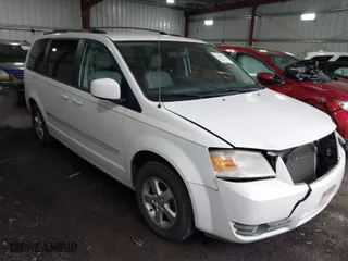 2009 Dodge Grand Caravan SXT with VIN 2D8HN54X89R512618, listed as a IAAI auction lot 41486547 with 116,979 mi miles. Bid and sale history available at carsss.com. Image 1.