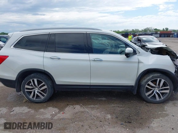 2017 Honda Pilot Touring with VIN 5FNYF6H9XHB034001, listed as a IAAI auction lot 42092549 with 142,422 mi miles and . Bid and sale history available at DreamBid. Image 13.