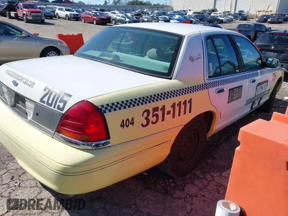 1999 Ford Crown Victoria Police z VIN 2FAFP71WXXX239705, wystawiony jako IAAI lot #41601390 z przebiegiem 161 454 mil mil oraz . Historia ofert i sprzedaży dostępna na DreamBid. Obrazek 4.