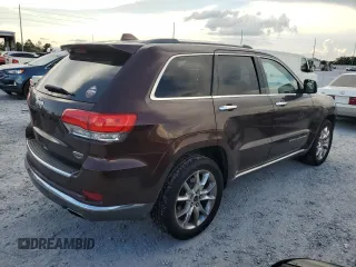 2014 Jeep Grand Cherokee Summit с VIN 1C4RJEJG4EC380074, выставлен на аукционе Copart как лот 64123175 с пробегом 237 803 миль миль и Списание • Salvage title. История ставок и продаж доступна на DreamBid. Изображение 3.