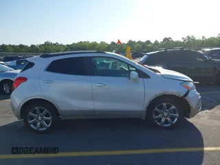 2016 Buick Encore Premium with VIN KL4CJDSB1GB647306, listed as a IAAI auction lot 41983159 with 59,592 mi miles. Bid and sale history available at carsss.com. Image 13.
