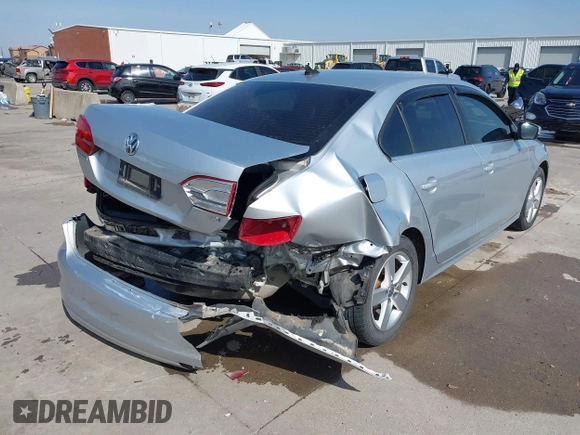 2014 Volkswagen Jetta TDI w/Premium with VIN 3VWLL7AJ6EM424935, listed as a IAAI auction lot 41533634 with 64,028 mi miles and . Bid and sale history available at DreamBid. Image 4.