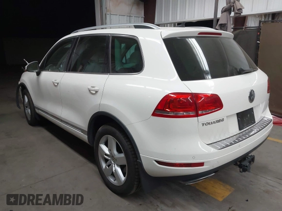 2012 Volkswagen Touareg Sport with VIN WVGFK9BP2CD002991, listed as a IAAI auction lot 42077523 with 94,515 mi miles and . Bid and sale history available at DreamBid. Image 3.