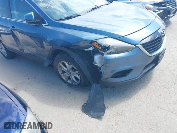 2015 Mazda CX-9 Sport with VIN JM3TB2BV7F0458193, listed as a IAAI auction lot 41886385 with 154,677 mi miles and . Bid and sale history available at carsss.com. Image 6.