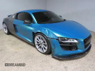 2011 Audi R8 z VIN WUAAUAFGXBN001538, wystawiony jako Copart lot #72457134 z przebiegiem 66 599 mil mil oraz Szkody całkowita. Historia ofert i sprzedaży dostępna na DreamBid. Obrazek 1.
