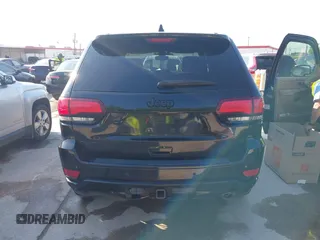 2017 Jeep Grand Cherokee Laredo with VIN 1C4RJFAGXHC817666, listed as a IAAI auction lot 42036817 with 119,698 mi miles. Bid and sale history available at carsss.com. Image 16.
