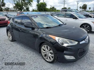 2013 Hyundai Veloster w/Black Int z VIN KMHTC6ADXDU157196, wystawiony jako Copart lot #58091015 z przebiegiem 136 201 mil mil oraz Szkoda całkowita • Salvage title. Historia ofert i sprzedaży dostępna na DreamBid. Obrazek 4.