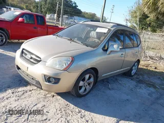 2007 Kia Rondo LX with VIN KNAFG526977114033, listed as a IAAI auction lot 40967531 with 126,761 mi miles. Bid and sale history available at carsss.com. Image 2.