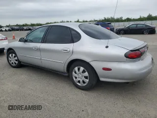 1999 Ford Taurus SE with VIN 1FAFP53U9XG290036, listed as a Copart auction lot 53505065 with 200,149 mi miles and Salvage title. Bid and sale history available at DreamBid. Image 2.