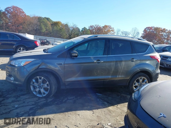 2014 Ford Escape Titanium with VIN 1FMCU9J94EUC50534, listed as a IAAI auction lot 41040341 with 115,502 mi miles. Bid and sale history available at carsss.com. Image 13.