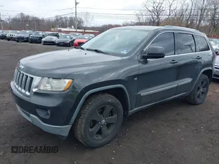 2011 Jeep Grand Cherokee Laredo with VIN 1J4RR4GGXBC597743, listed as a IAAI auction lot 41897286 with 253,111 mi miles and . Bid and sale history available at DreamBid. Image 18.