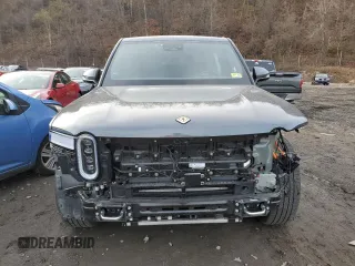 2023 Rivian R1T Adventure z VIN 7FCTGBAA8PN028065, wystawiony jako Copart lot #81941474 z przebiegiem 16 060 mil mil oraz Szkoda całkowita • Salvage title. Historia ofert i sprzedaży dostępna na DreamBid. Obrazek 5.