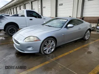 2007 Jaguar XK with VIN SAJWA43B775B07074, listed as a Copart auction lot 86350144 with 117,915 mi miles and Salvage Title. Bid and sale history available at carsss.com. Image 1.