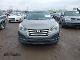2016 Hyundai Santa Fe z VIN 5XYZTDLB1GG343763, wystawiony jako IAAI lot #41659641 z przebiegiem 96 415 mil mil oraz . Historia ofert i sprzedaży dostępna na DreamBid. Obrazek 12.