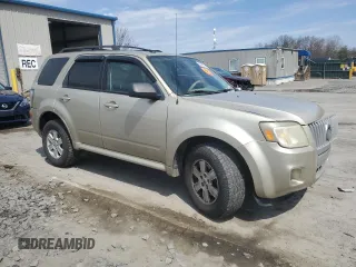 2010 Mercury Mariner z VIN 4M2CN9BG0AKJ17705, wystawiony jako Copart lot #53790315 z przebiegiem 154 832 mil mil oraz Szkody całkowita. Historia ofert i sprzedaży dostępna na DreamBid. Obrazek 4.