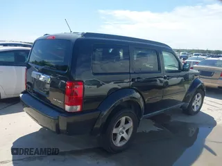 2010 Dodge Nitro SXT z VIN 1D4PT5GK2AW104047, wystawiony jako IAAI lot #42454184 z przebiegiem 132 041 mil mil oraz . Historia ofert i sprzedaży dostępna na DreamBid. Obrazek 4.