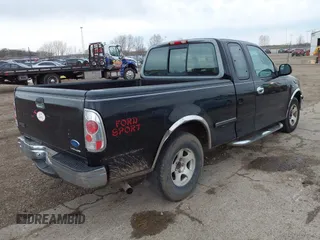 1997 Ford F-150 with VIN 2FTDX1720VCA73590, listed as a IAAI auction lot 41956713 with 128,220 mi miles and . Bid and sale history available at DreamBid. Image 4.