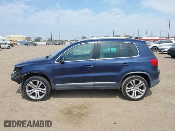 2012 Volkswagen Tiguan SEL with VIN WVGAV7AX8CW536752, listed as a IAAI auction lot 41798619 with 128,223 mi miles and . Bid and sale history available at DreamBid. Image 14.
