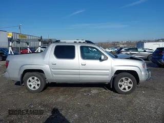 2006 Honda Ridgeline RTL z VIN 2HJYK165X6H570027, wystawiony jako IAAI lot #41868389 z przebiegiem 207 020 mil mil oraz . Historia ofert i sprzedaży dostępna na DreamBid. Obrazek 13.