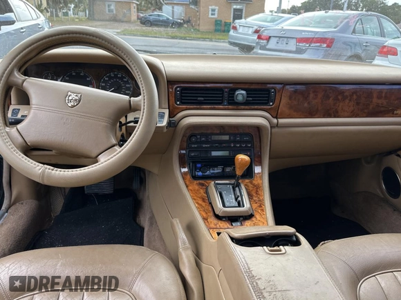1995 Jaguar XJ with VIN SAJHX174XSC738291, listed as a Copart auction lot 87054224 with 71,076 mi miles and Clean title. Bid and sale history available at DreamBid. Image 9.
