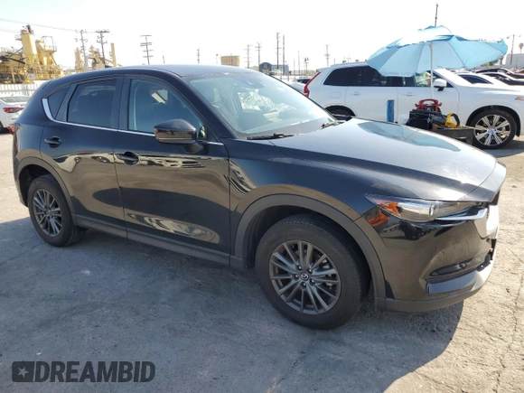 2021 Mazda CX-5 Touring with VIN JM3KFBCM8M0495899, listed as a Copart auction lot 51049235 with 31,164 mi miles and Salvage Title. Bid and sale history available at carsss.com. Image 4.