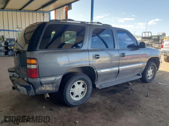 2001 GMC Yukon SLT z VIN 1GKEK13T21J165558, wystawiony jako Copart lot #52200565 z przebiegiem 291 699 mil mil oraz Szkoda całkowita • Salvage title. Historia ofert i sprzedaży dostępna na DreamBid. Obrazek 3.